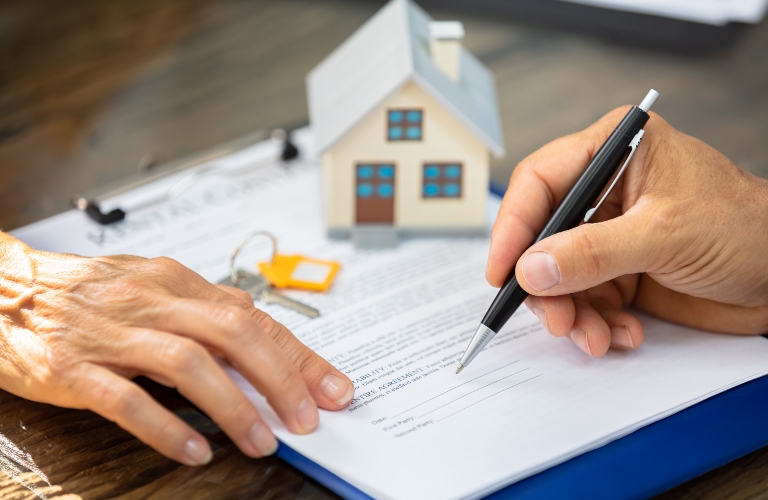 People working on housing paperwork