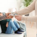man gives money to woman for alimony for son