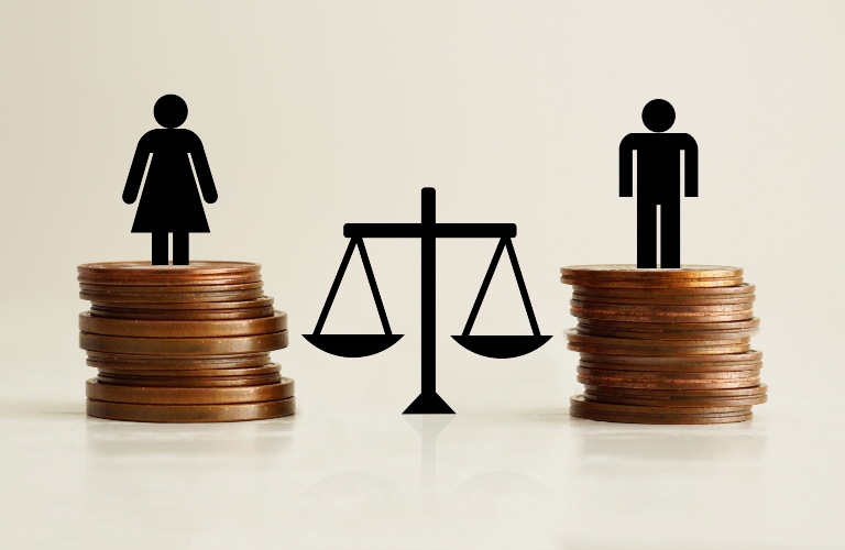 male and female figures stand on coins near the scales of justice