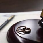wedding bands and gavel on desk_s